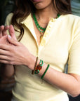 Armband met grote opengewerkte bedel / groen