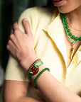 Armband met grote opengewerkte bedel / groen