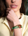 Armband met grote opengewerkte bedel / groen
